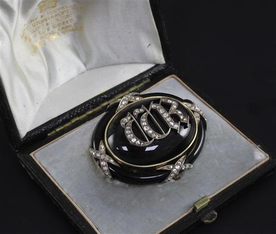 A Victorian gold, black enamel and rose cut diamond mourning pendant brooch in Hunt & Roskell fitted box, 2in.